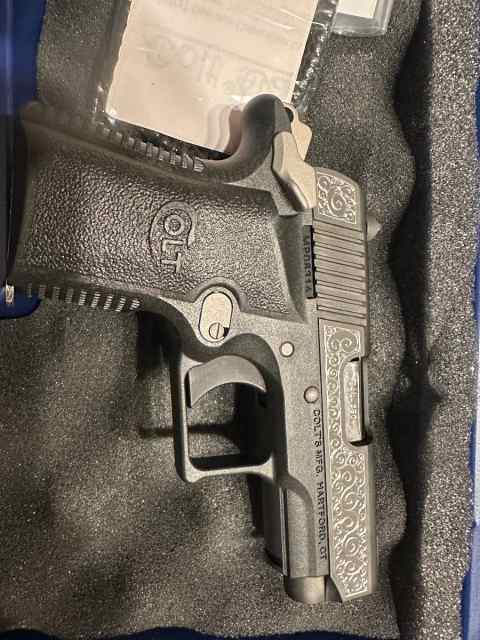 Engraved Colt Mustang