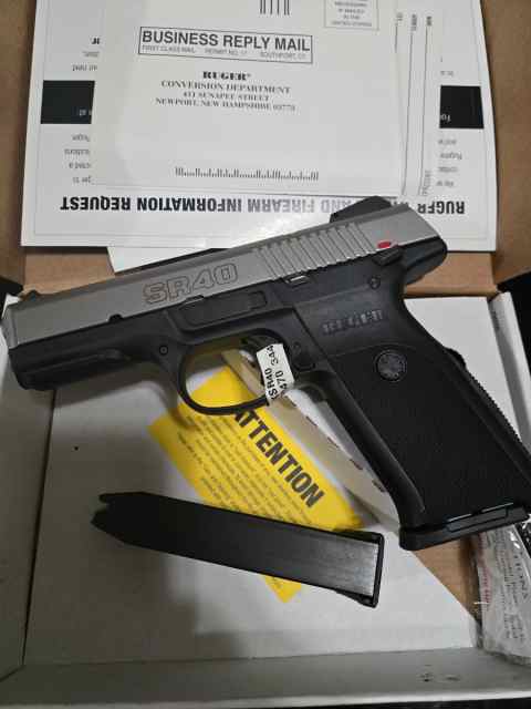 NEW NEVER FIRED RUGER SR40 WITH AMMO